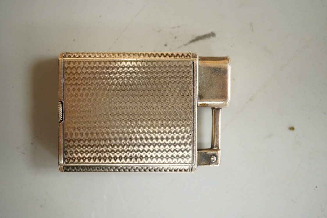 Two vintage lighters comprising an Everest 925 silver lighter, 49mm and a Dunhill plated lighter
